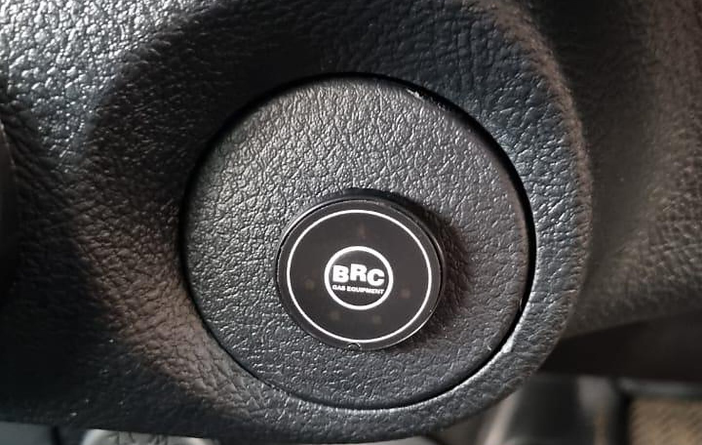 BRC fuel switch button on a car dashboard