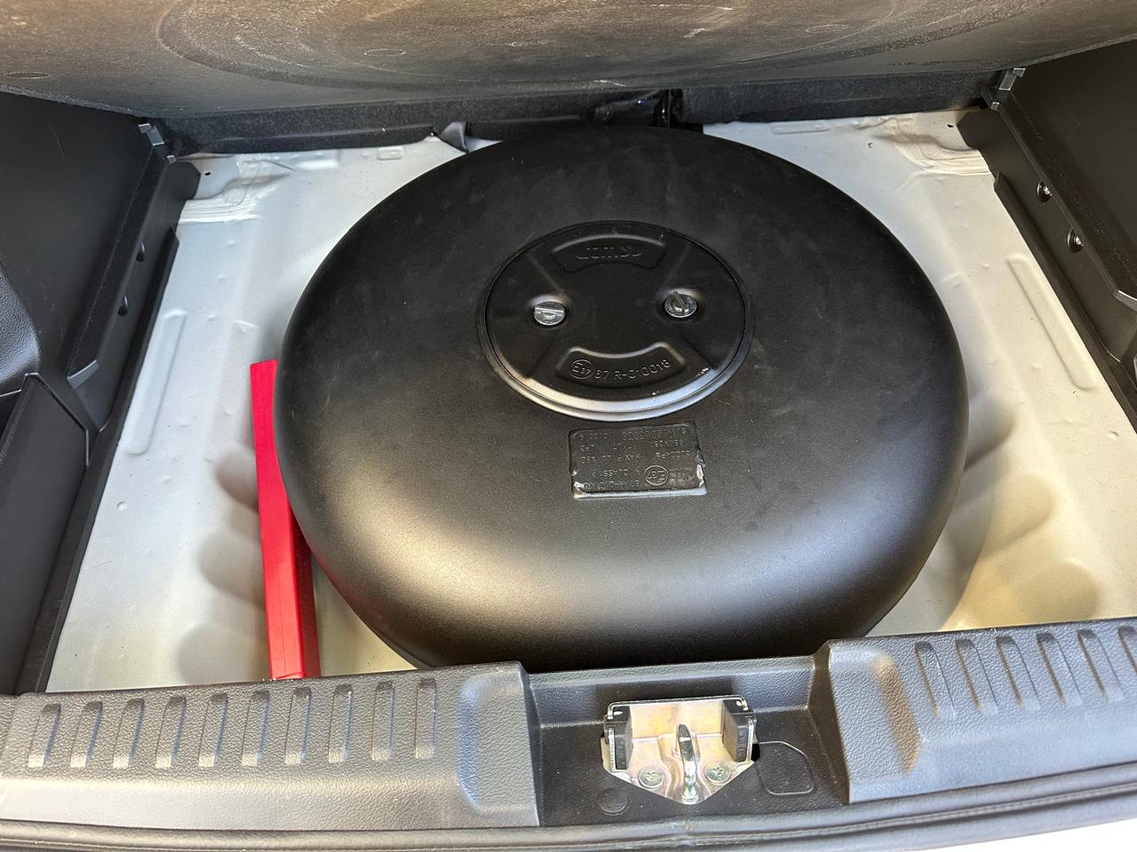 Round donut-shaped LPG Autogas tank fitted in a car's spare-wheel well